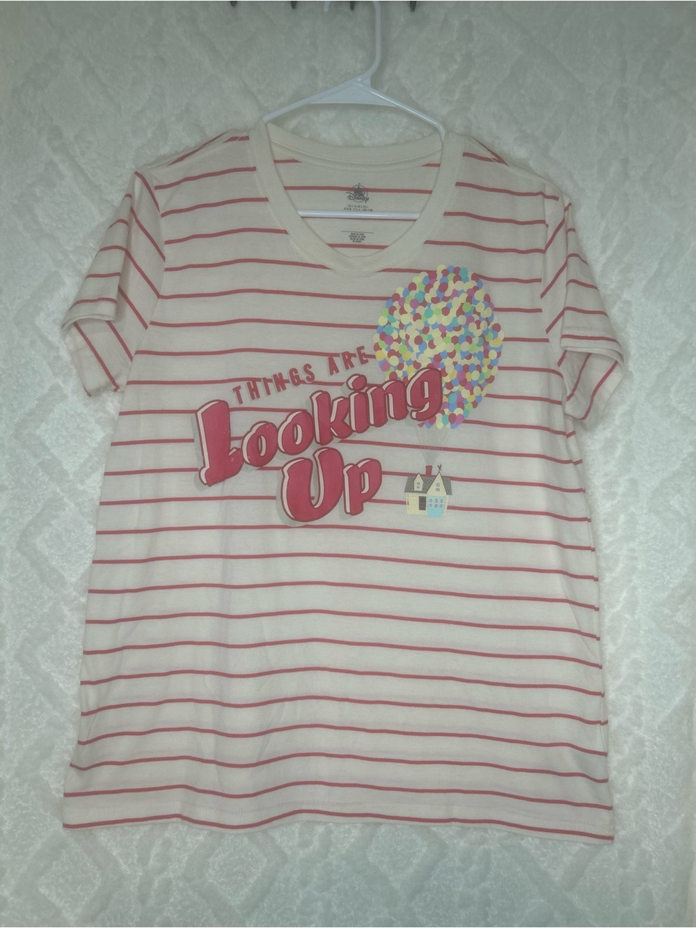 Disney’s “Up” Cream Tee with Pink Stripes and Colorful Balloon Graphic